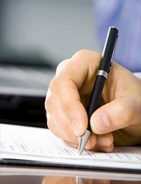 Person signing a document.